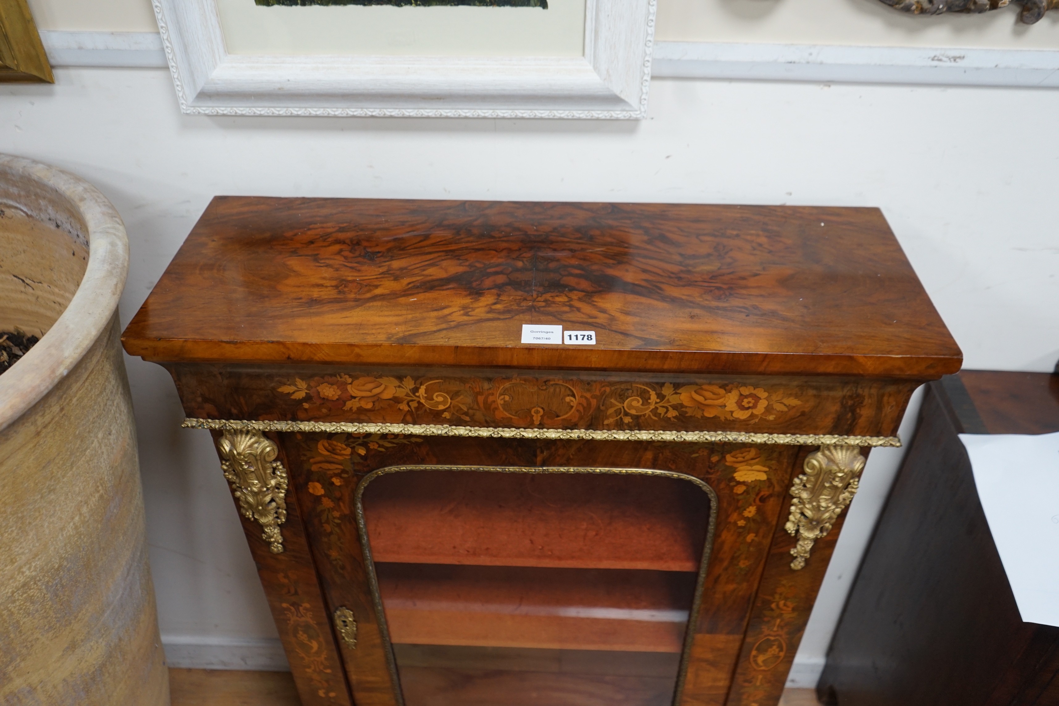 A Victorian ormolu mounted walnut and marquetry pier cabinet, width 84cm, depth 30cm, height 112cm